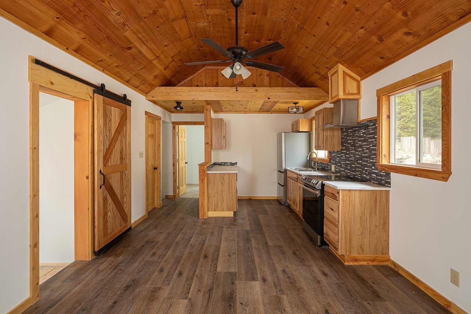 318 Coates Avenue Calpine, CA 96124 - Photo 4 of 21 a view of a walk in closet with wooden floor