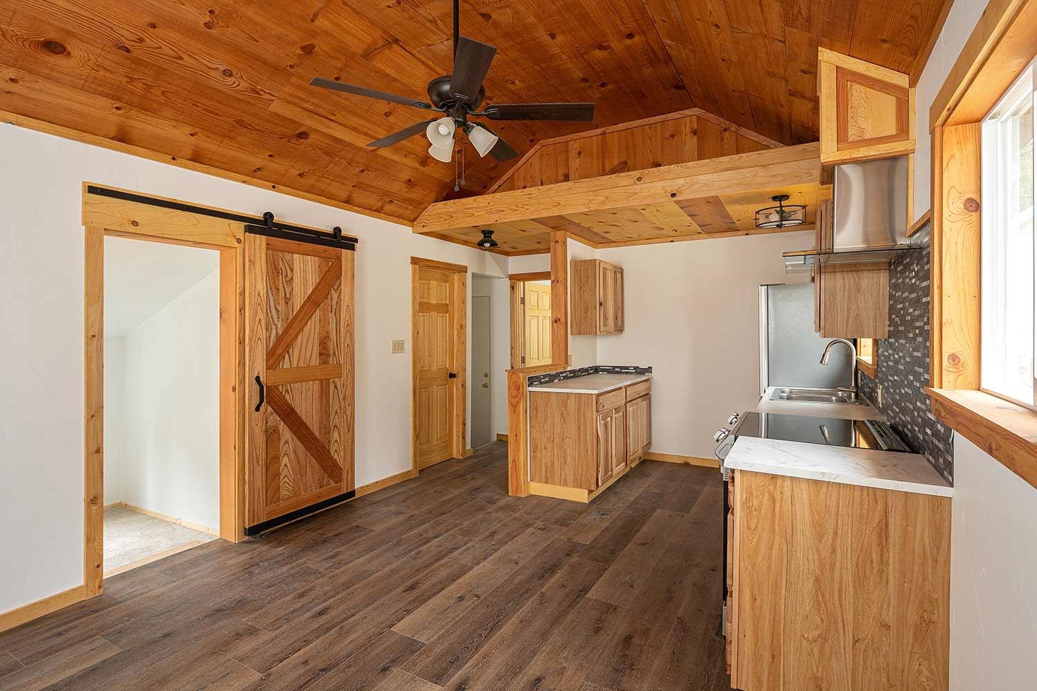 318 Coates Avenue Calpine, CA 96124 - Photo 6 of 21 a view of a room with wooden floor and furniture