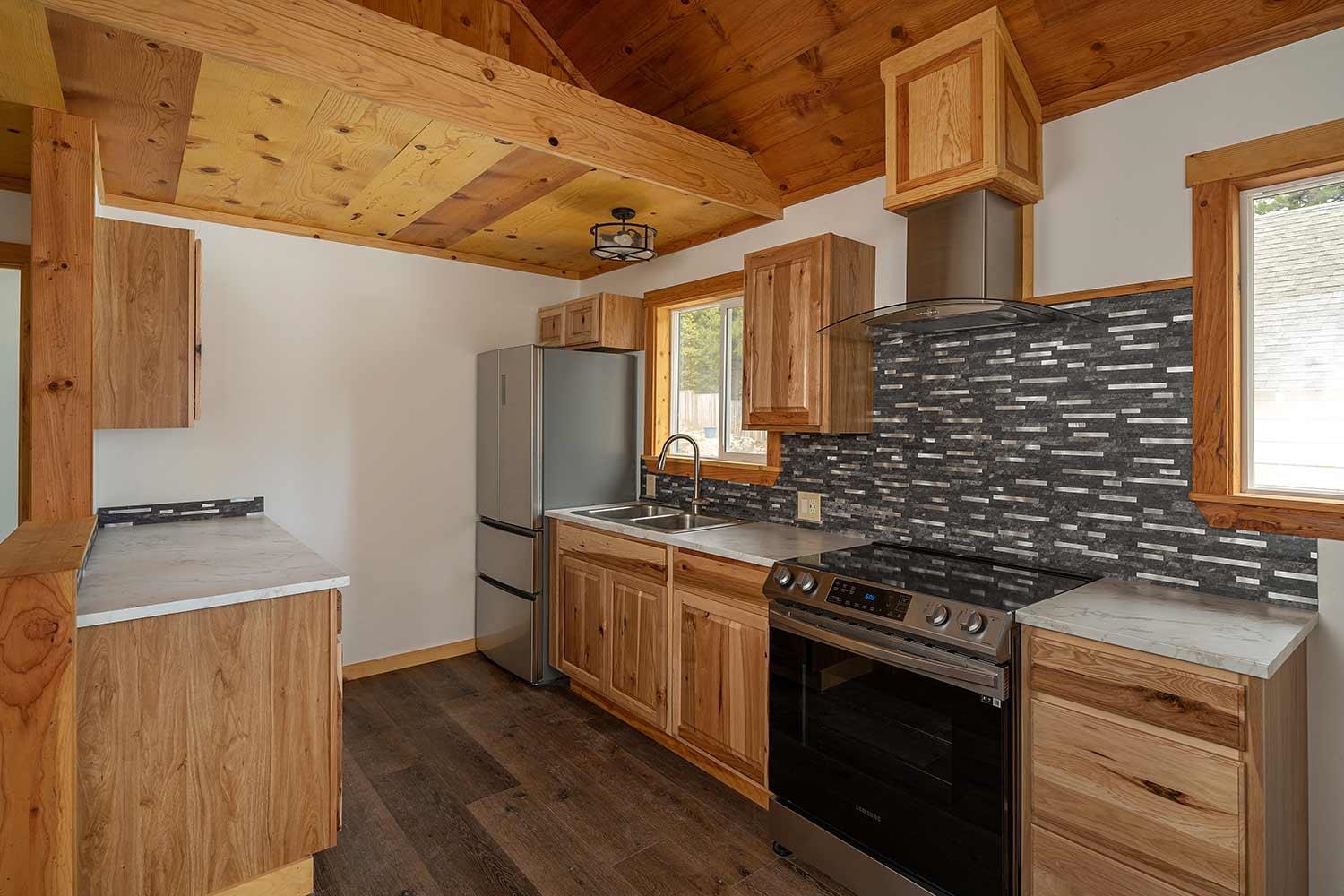 318 Coates Avenue Calpine, CA 96124 - Photo 8 of 21 a kitchen with stainless steel appliances granite countertop a stove and a refrigerator