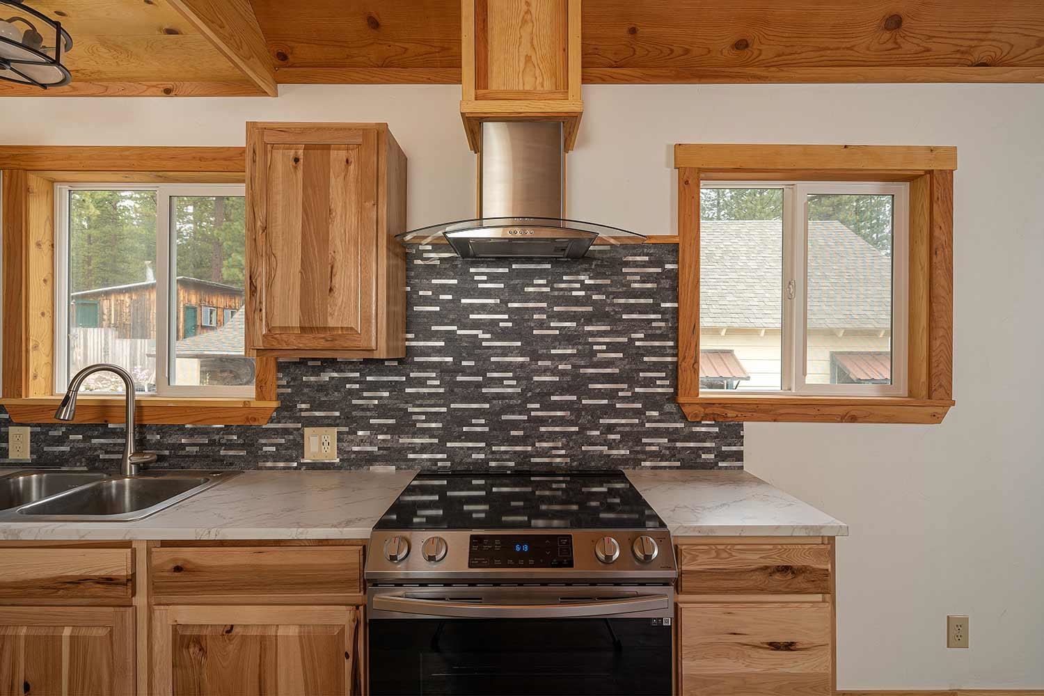 318 Coates Avenue Calpine, CA 96124 - Photo 10 of 21 a stove top oven sitting inside of a kitchen
