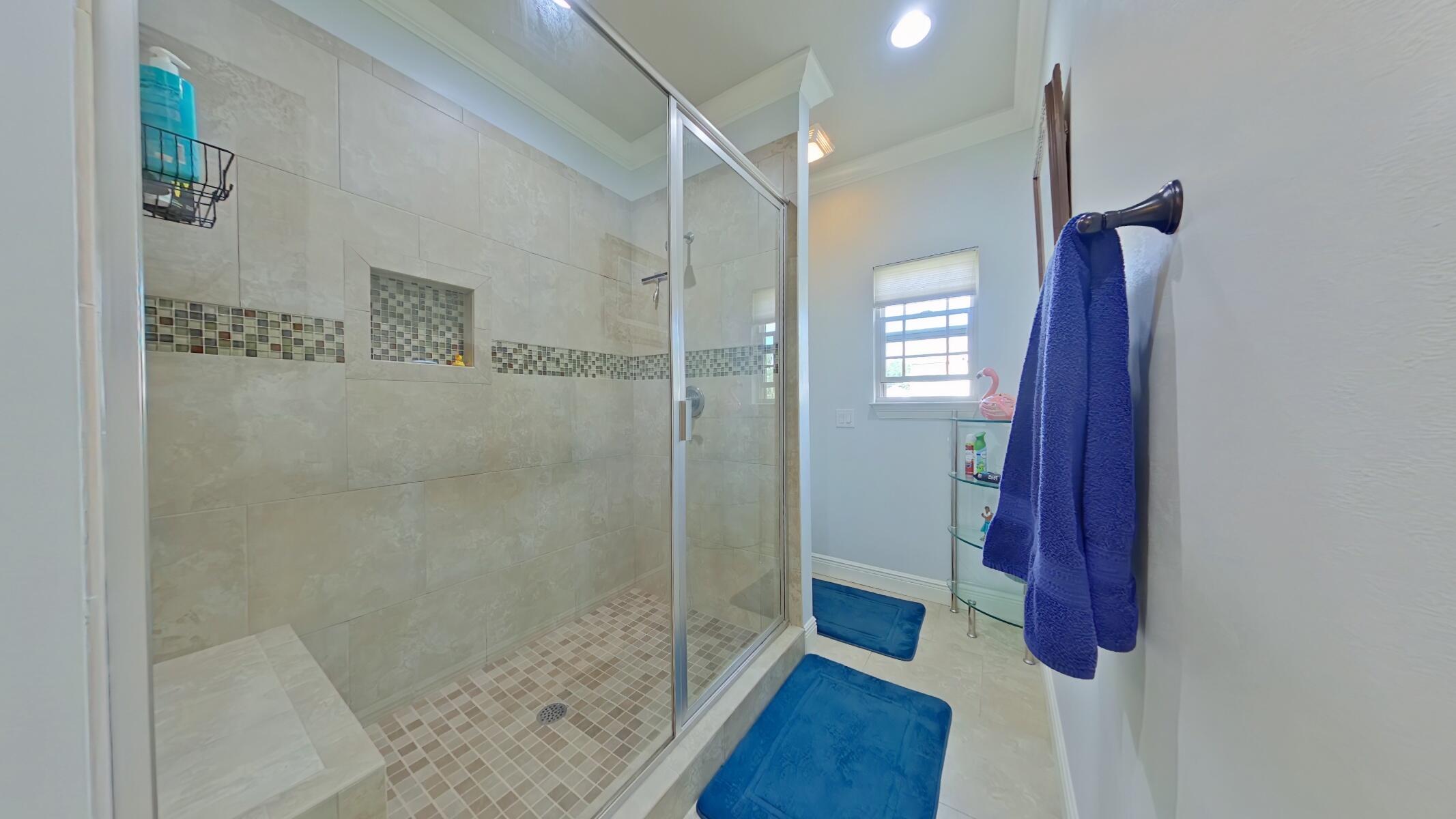 8686 El Paseo Street Navarre, FL 32566 - Photo 18 of 39 a bathroom with a shower