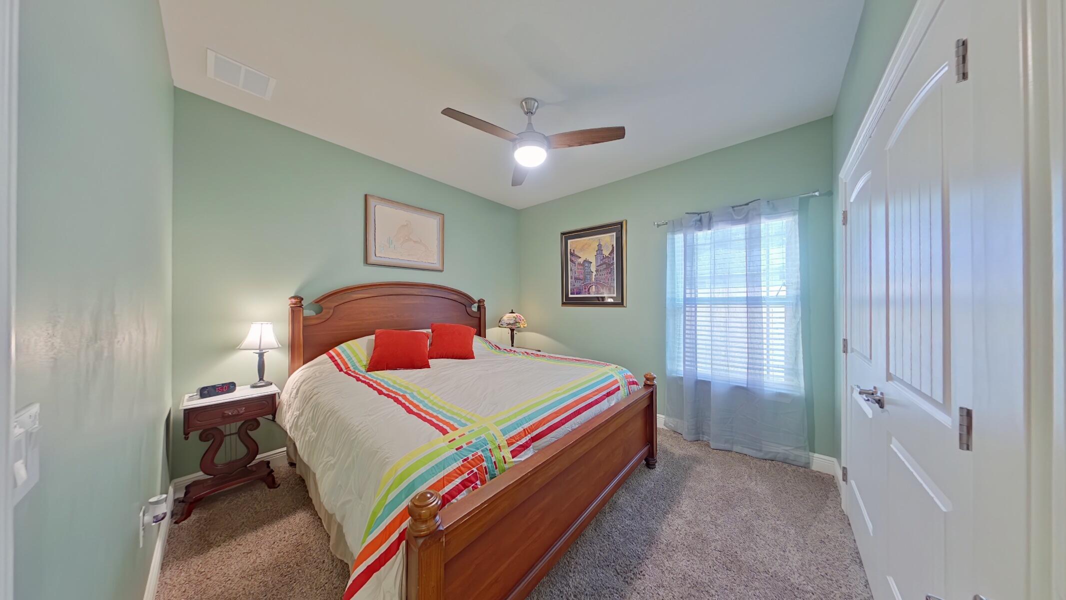 8686 El Paseo Street Navarre, FL 32566 - Photo 21 of 39 a bed room with a bed and a window