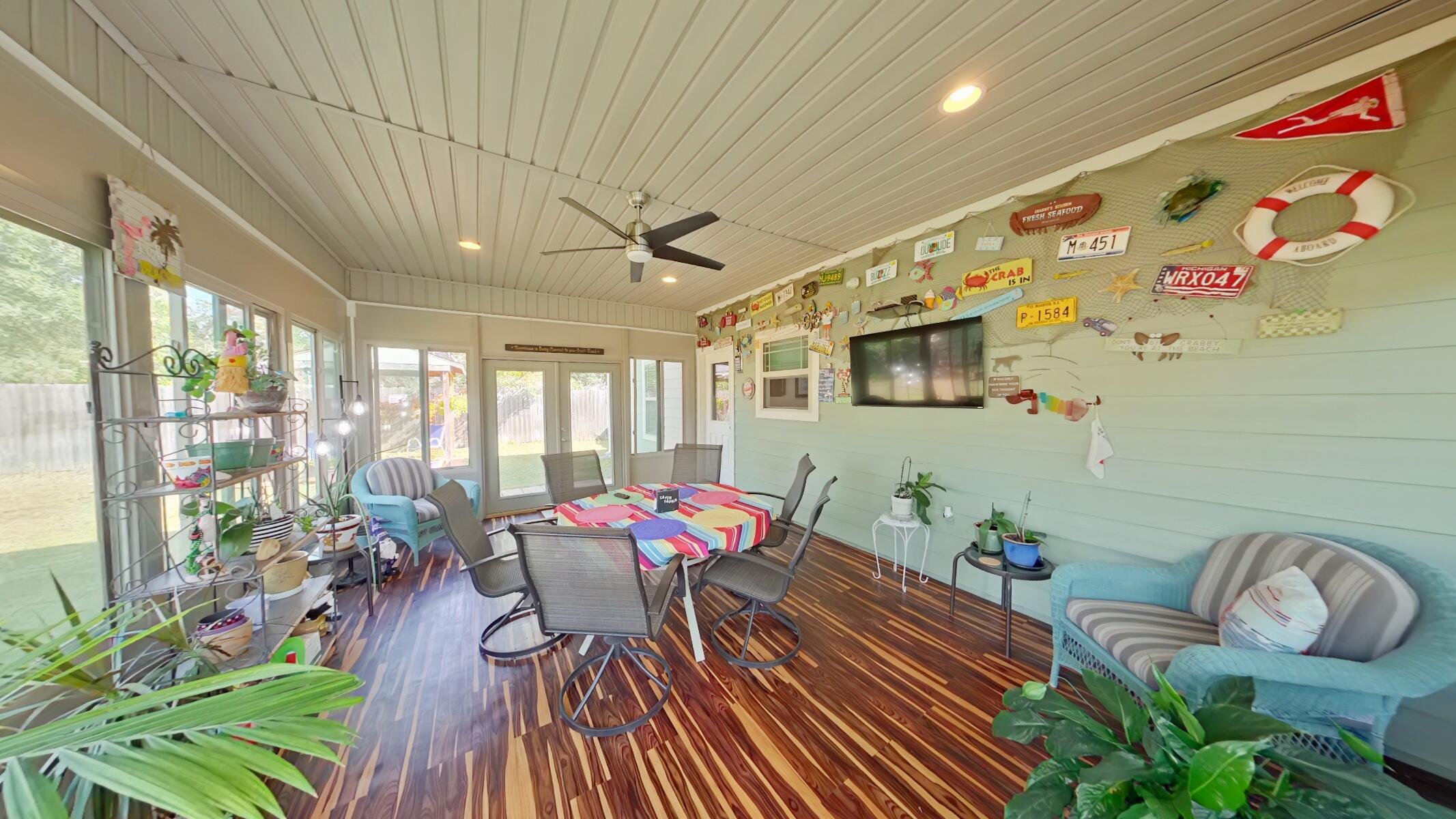 8686 El Paseo Street Navarre, FL 32566 - Photo 27 of 39 a living room with furniture and a potted plant