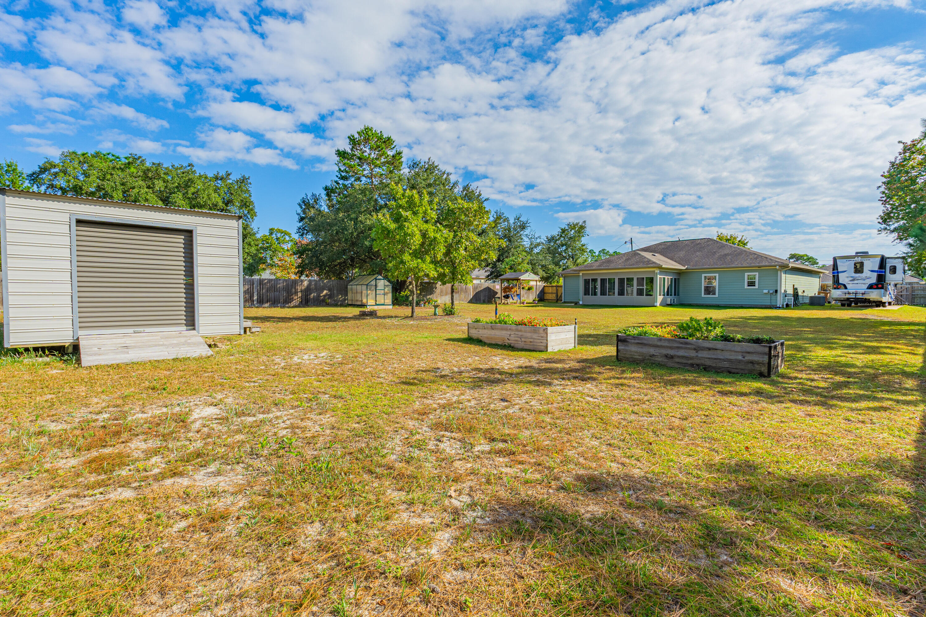 8686 El Paseo Street Navarre, FL 32566 - Photo 31 of 39 a view of a swimming pool and an outdoor space
