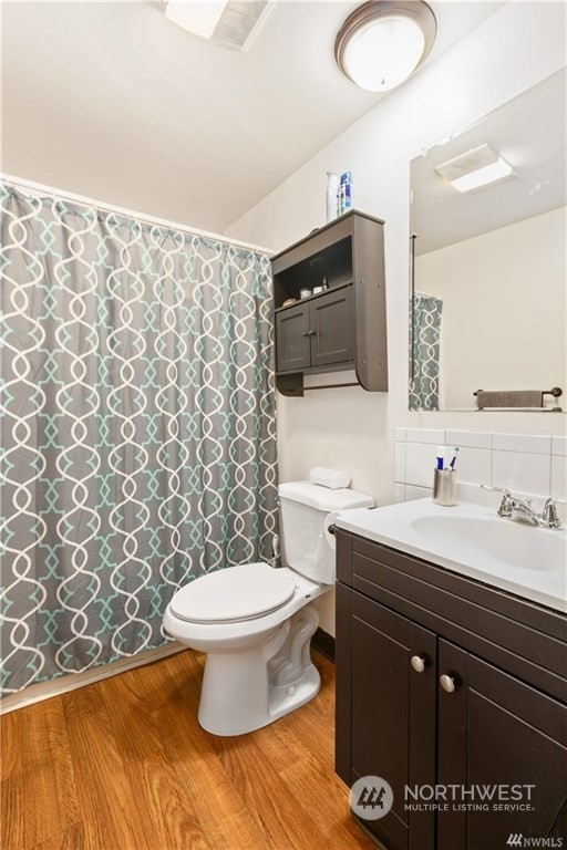 130 Bellflower Road Bothell, WA 98012 - Photo 11 of 25 a bathroom with a sink toilet and mirror