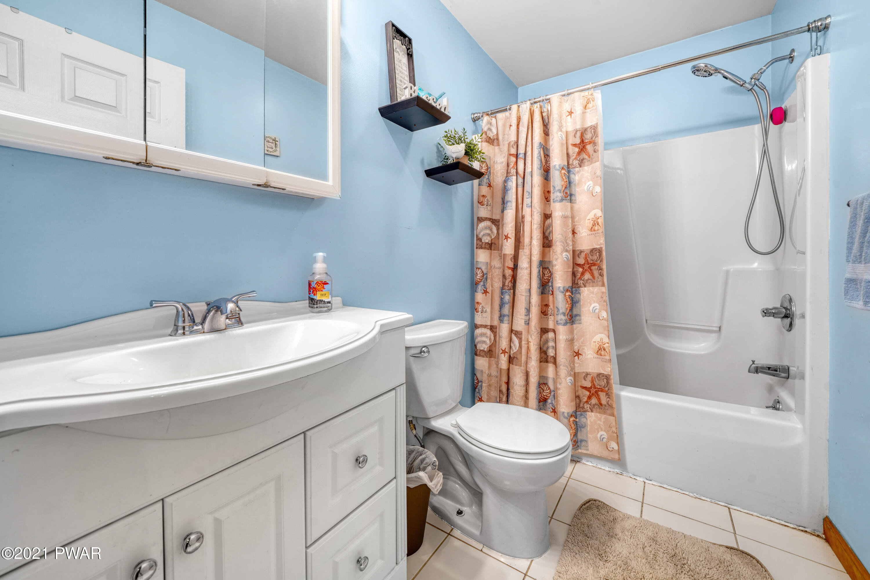 125 Forest Road Dingmans Ferry, PA 18328 - Photo 19 of 28 a bathroom with a sink toilet and shower