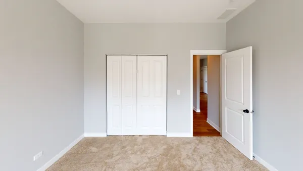 a view of a room with an empty space and hallway