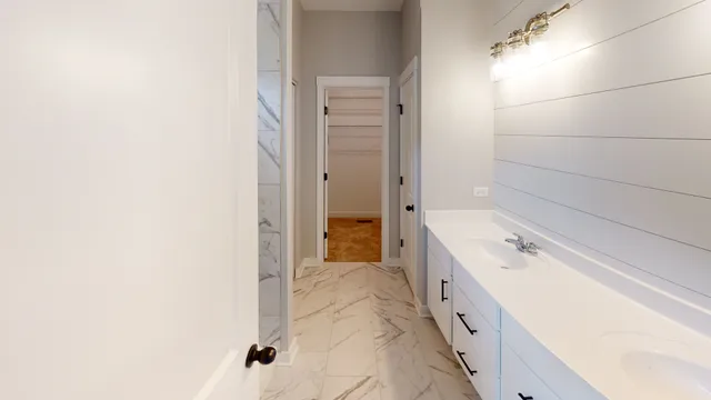 a bathroom with a double vanity sink and mirror