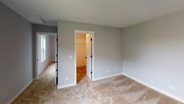 an empty room with a bathroom