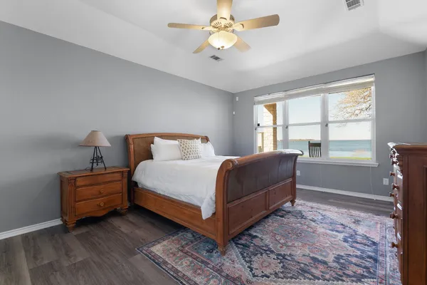 wooden floor with white cabinets and wooden floors
