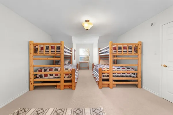 a bedroom with furniture and a window