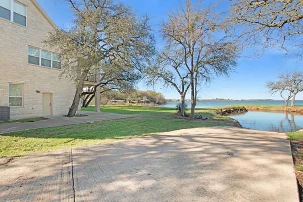 a view of a park with large trees