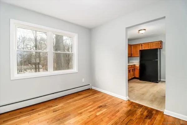 a kitchen with stainless steel appliances granite countertop a refrigerator stove and sink