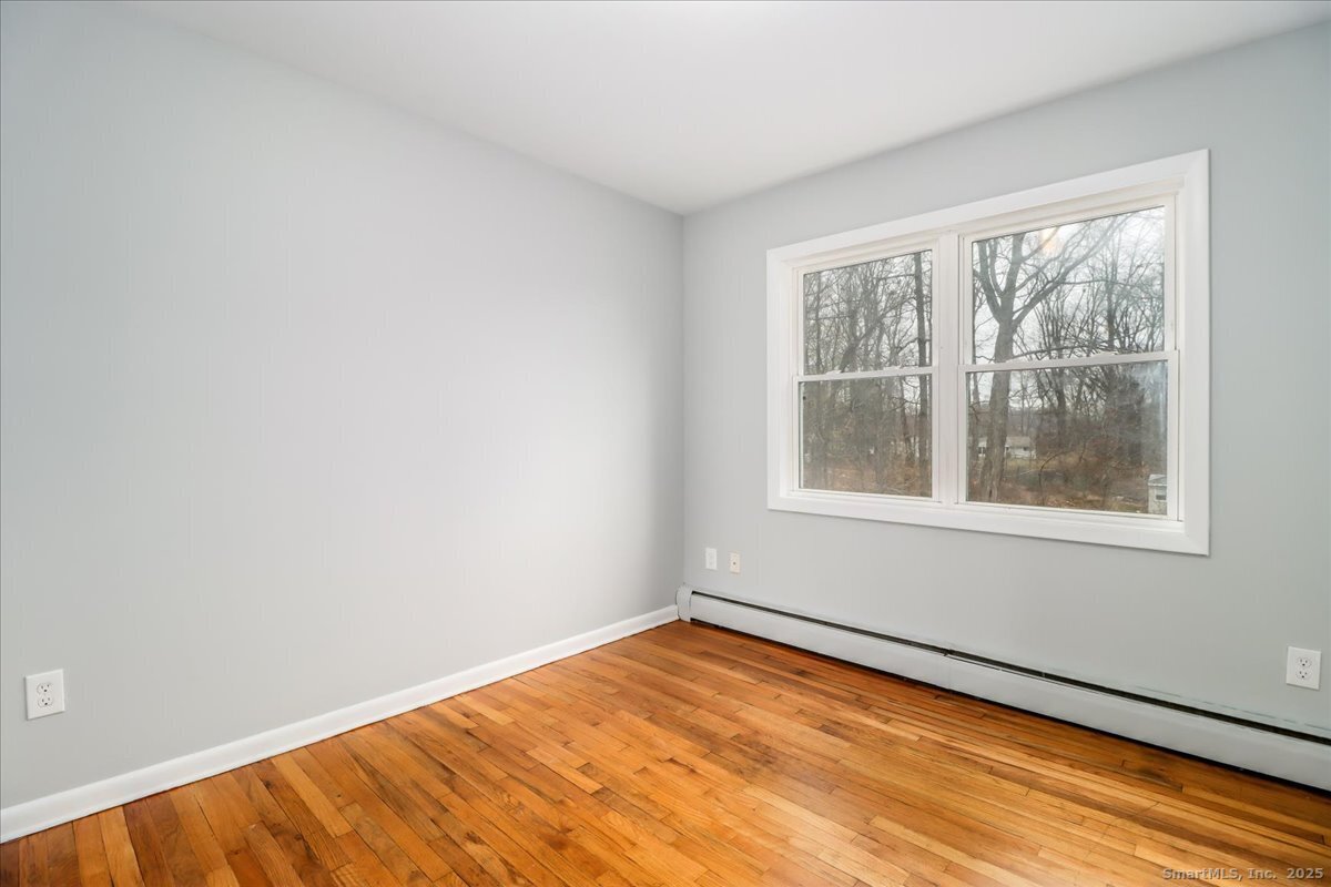 32 Pleasant Street Bethel, CT 06801 - Photo 10 of 29 a view of empty room with window