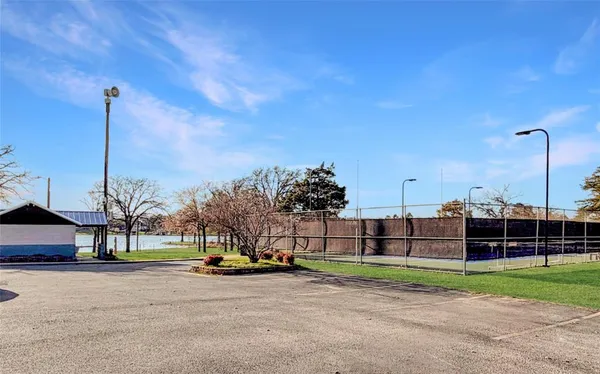 a view of a park with large trees