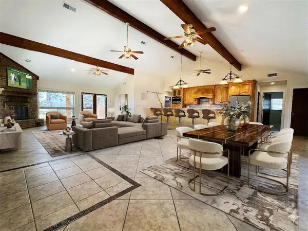 a living room with lots of furniture and a chandelier
