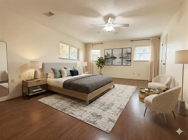 a bedroom with furniture and a chandelier