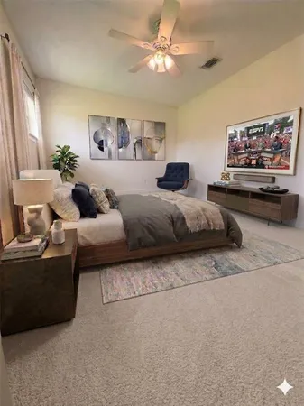 a living room with furniture and a potted plant
