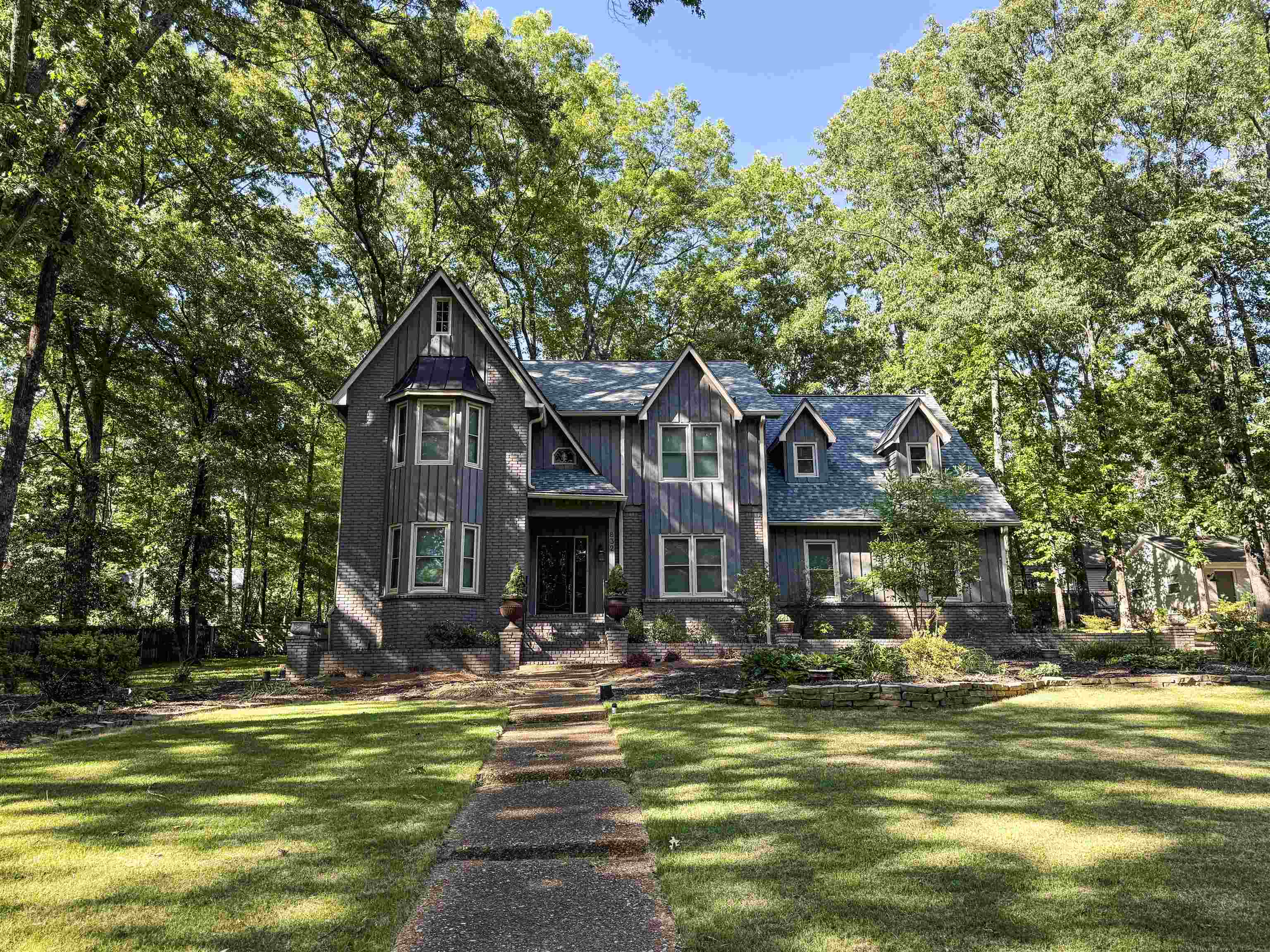 832 South Tree Drive Collierville, TN 38017 - Photo 36 of 40 Gable-front home featuring board and batten siding and a stone foundation