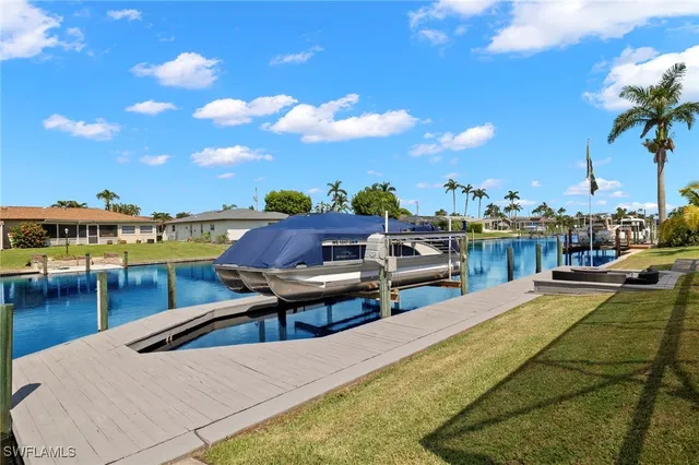 a view of a swimming pool with lounge chairs