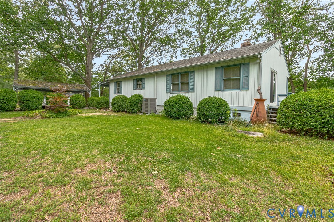 142 Bridge Lane Reedville, VA 22539 - Photo 55 of 56 a view of a house with a yard