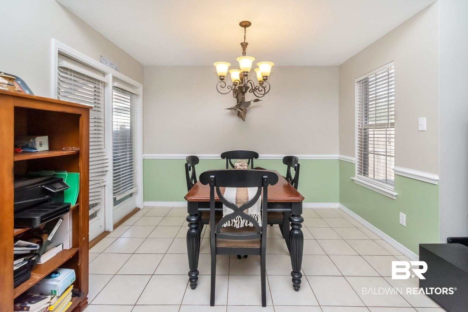 29221 Canterbury Road Daphne, AL 36526 - Photo 3 of 17 Dining space featuring a chandelier, plenty of natural light, and light tile patterned flooring