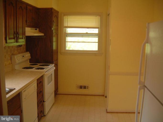 2603 Loma Street Silver Spring, MD 20902 - Photo 3 of 12 Kitchen has two exterior windows.