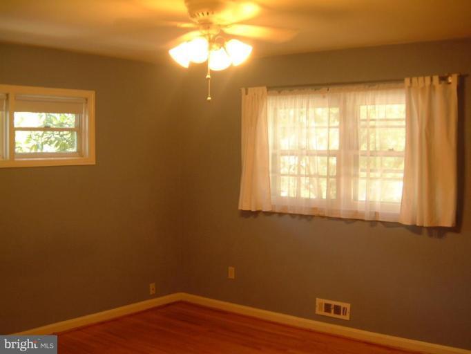 2603 Loma Street Silver Spring, MD 20902 - Photo 10 of 12 Master bedroom w/hardwood floor & ceiling fan.