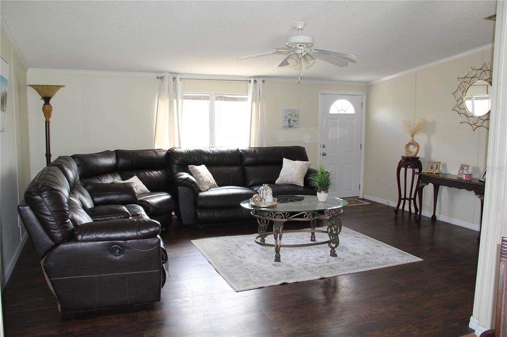 13127 Star Road Brooksville, FL 34613 - Photo 8 of 54 a living room with furniture and wooden floor