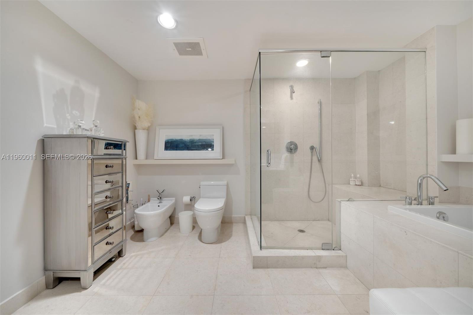 465 Brickell Avenue, Unit 2703 Miami, FL 33131 - Photo 18 of 40 a bathroom with a double vanity sink mirror and shower