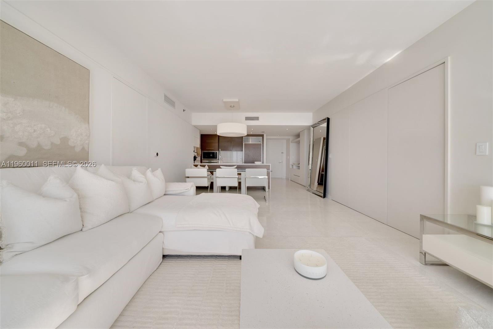 465 Brickell Avenue, Unit 2703 Miami, FL 33131 - Photo 3 of 40 a living room with furniture and white walls