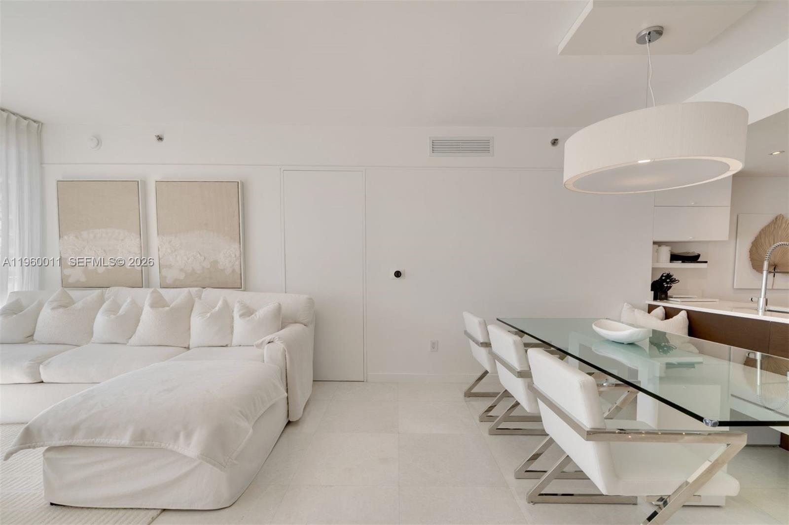 465 Brickell Avenue, Unit 2703 Miami, FL 33131 - Photo 7 of 40 a living room with furniture and a table