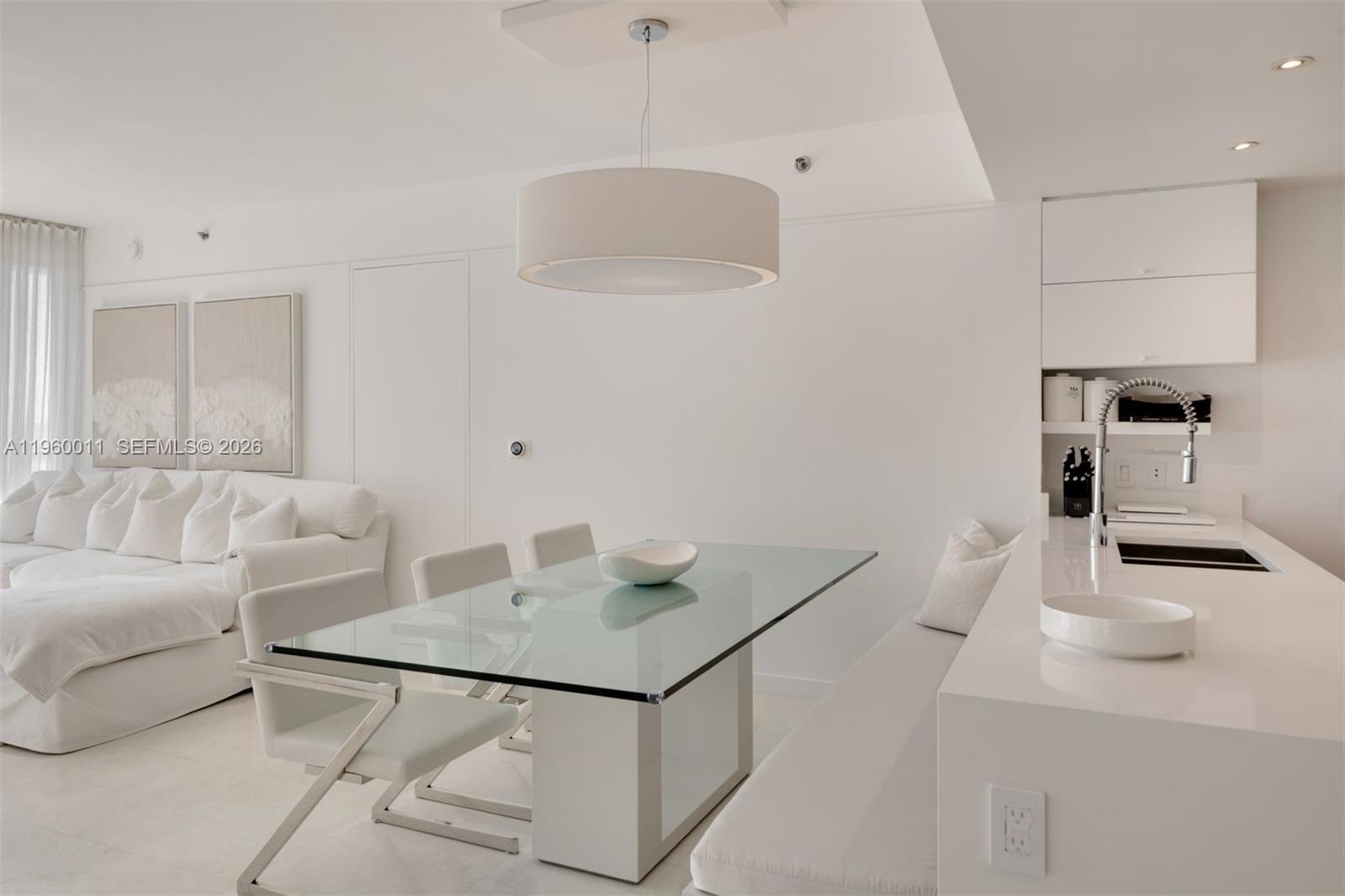 465 Brickell Avenue, Unit 2703 Miami, FL 33131 - Photo 10 of 40 a living room with furniture and a table