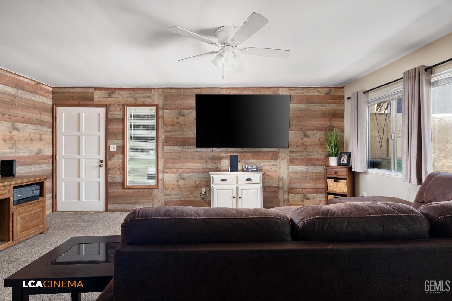 Undisclosed Address Bakersfield, CA 93308 - Photo 1 of 20 a living room with furniture and a flat screen tv