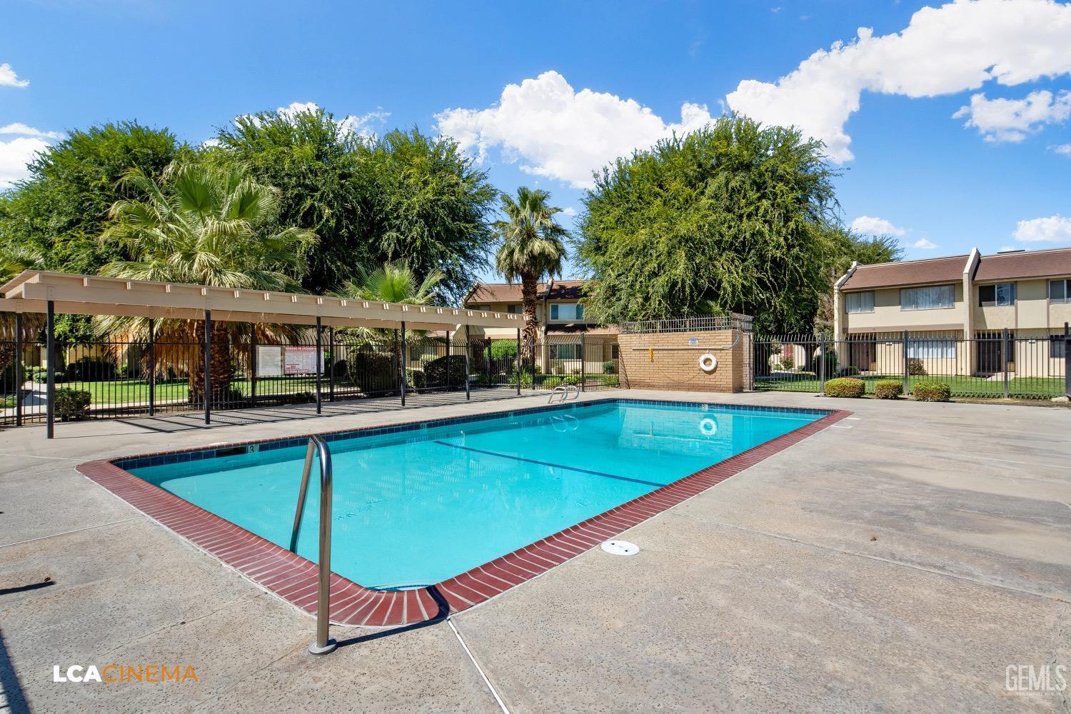 Undisclosed Address Bakersfield, CA 93308 - Photo 13 of 20 a view of a house with swimming pool
