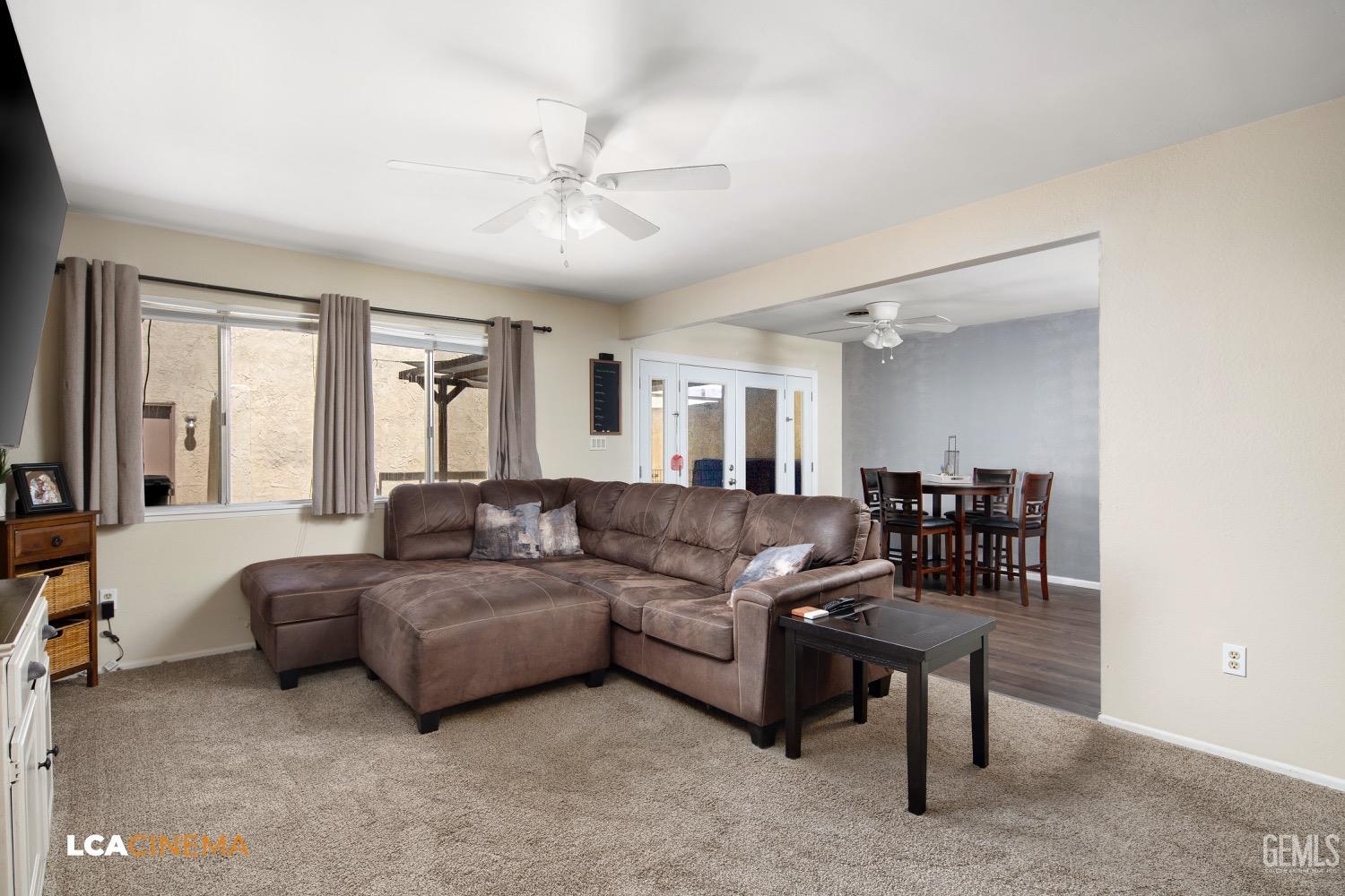 Undisclosed Address Bakersfield, CA 93308 - Photo 5 of 20 a living room with furniture and a large window