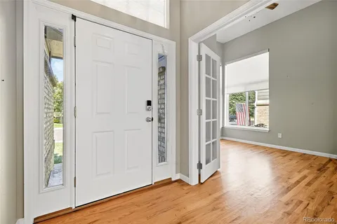 a view of entryway with wooden floor