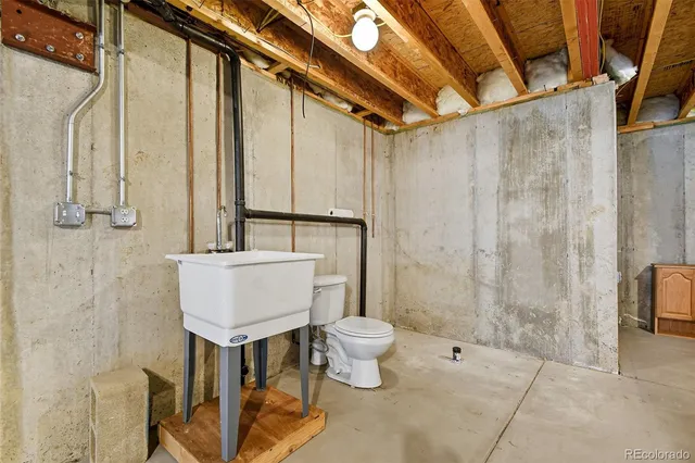 a bathroom with a toilet sink and shower