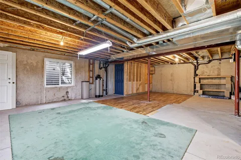 a view of a room with wooden walls and stairs