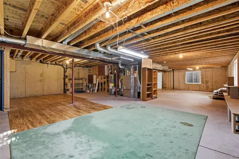 a view of a empty room with wooden ceiling
