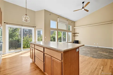 a view of a kitchen with a sink and wooden floor