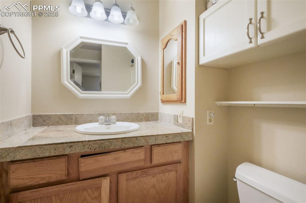 6802 Galley Road Colorado Springs, CO 80915 - Photo 19 of 50 a bathroom with 2 sink and a mirror