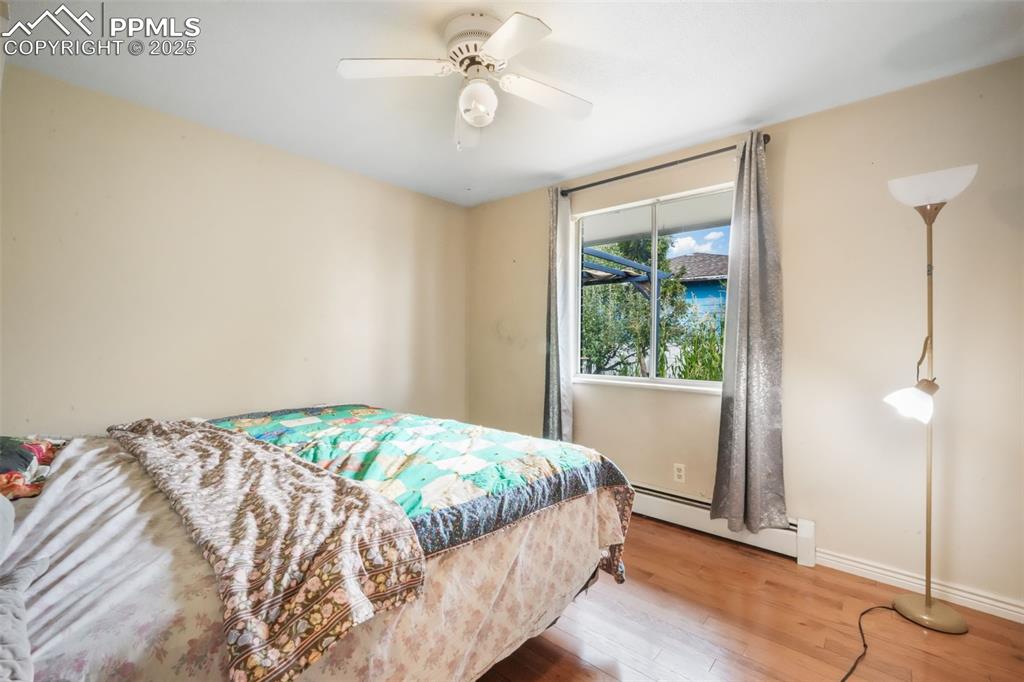 6802 Galley Road Colorado Springs, CO 80915 - Photo 20 of 50 a bedroom with a bed and a window