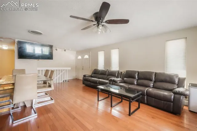 a living room with furniture and a flat screen tv