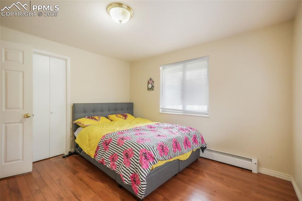 6802 Galley Road Colorado Springs, CO 80915 - Photo 25 of 50 a bedroom with a bed and a window
