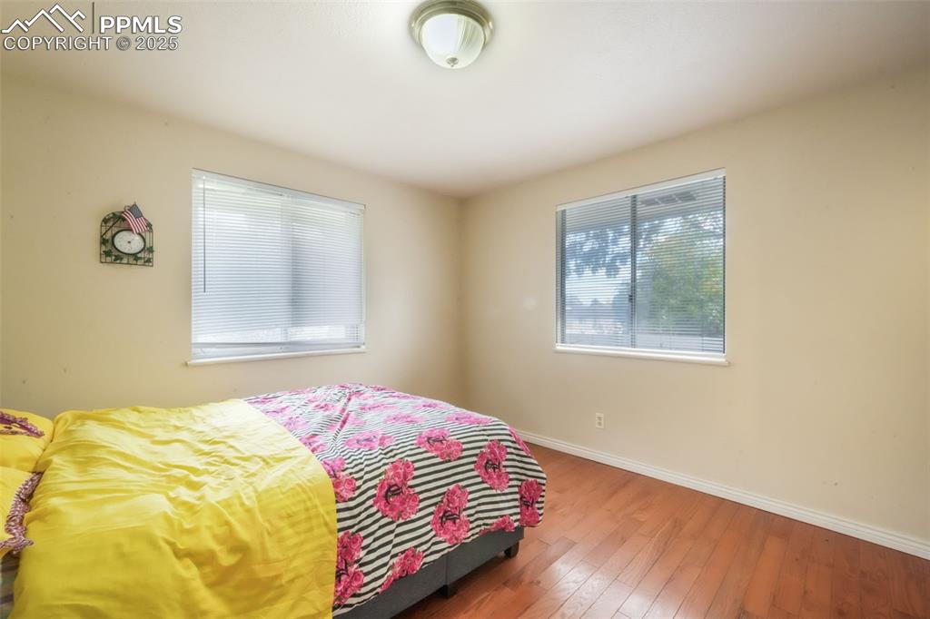 6802 Galley Road Colorado Springs, CO 80915 - Photo 26 of 50 a bedroom with a bed and a window