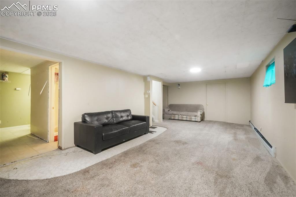 6802 Galley Road Colorado Springs, CO 80915 - Photo 30 of 50 a living room with furniture and a couch