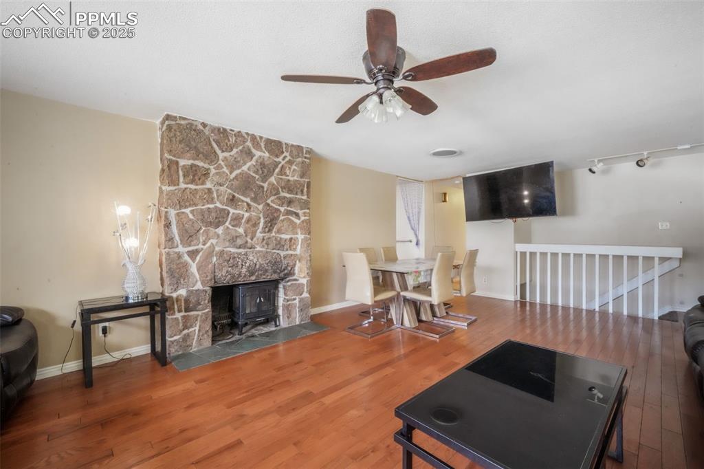 6802 Galley Road Colorado Springs, CO 80915 - Photo 3 of 50 a living room with furniture and a fireplace