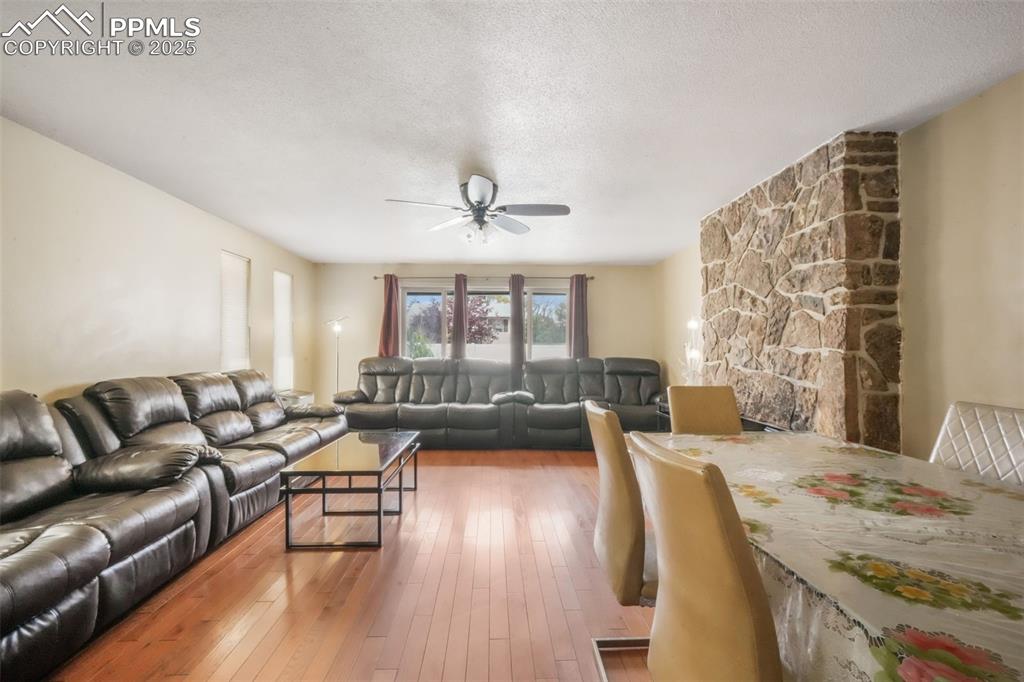 6802 Galley Road Colorado Springs, CO 80915 - Photo 4 of 50 a living room with furniture and a large window