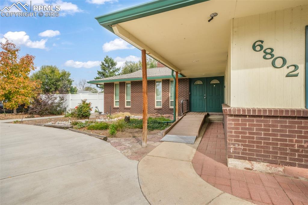 6802 Galley Road Colorado Springs, CO 80915 - Photo 42 of 50 a front view of a house with garden